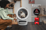 Cat exiting white Litter-Robot 4 automatic litter box also showcasing Forbes and Time best invention badges